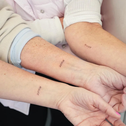 Small Fine Line Word Family Tattoo on Women Arm by @hktattoo_tina