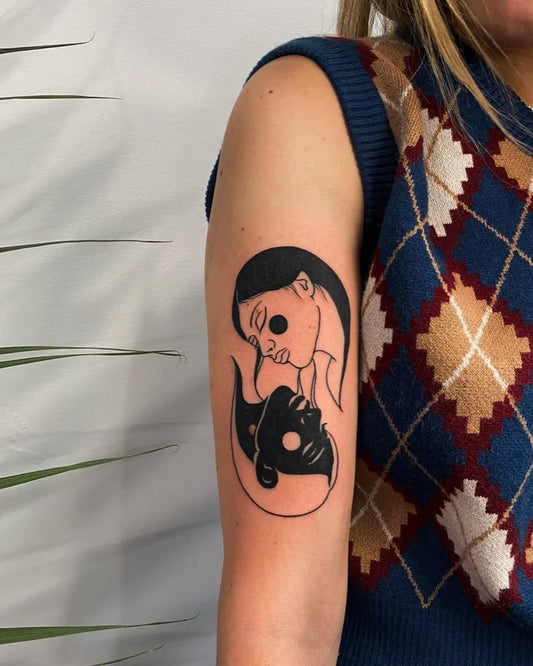 Small Fine Line Yin Yang Faces Tattoo on Women Upper Arm by @taylorlafortuna