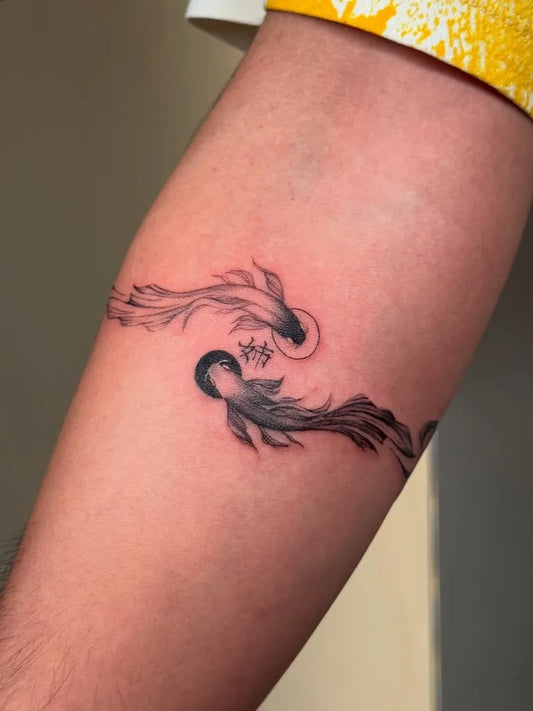 Small Fine Line Yin Yang Koi Tattoo on Women Arm by @colette.ink