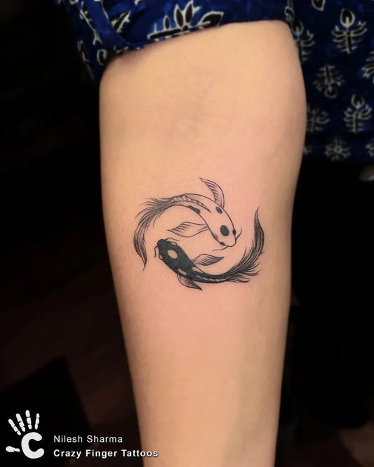 Small Fine Line Yin Yang Koi Tattoo on Women Arm by @crazyfingertattoos