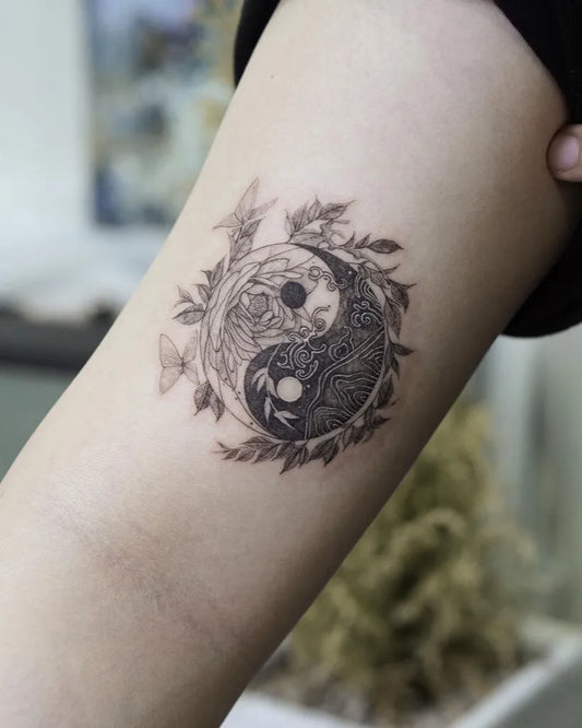 Small Fine Line Yin Yang with Flowers and Leaves Tattoo on Women Arm by @tattooist_rain