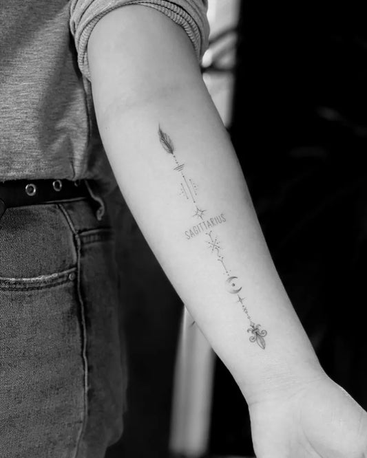 Small FineLine Arrow with Sagittarius Tattoo on Women Arm by @trontatts