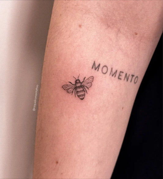 Small FineLine Bee with Memento on Women Arm Tattoo by @raquelromantattoo