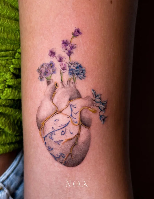 Small FineLine Broken Heart with Flowers on Women Arm Tattoo by @zephyr_tattoo_