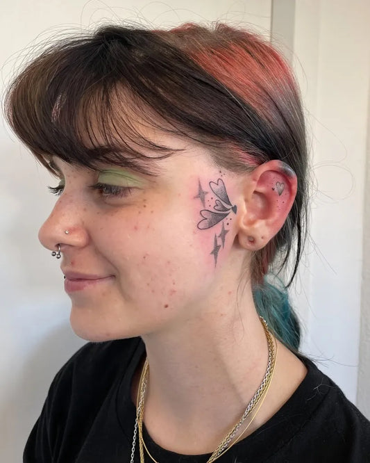 Small FineLine Butterfly on Women Face Tattoo by @maylancholy.ttt