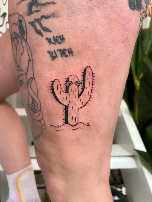 Small FineLine Cactus Tattoo on Women Thigh by @donnie.tattoos