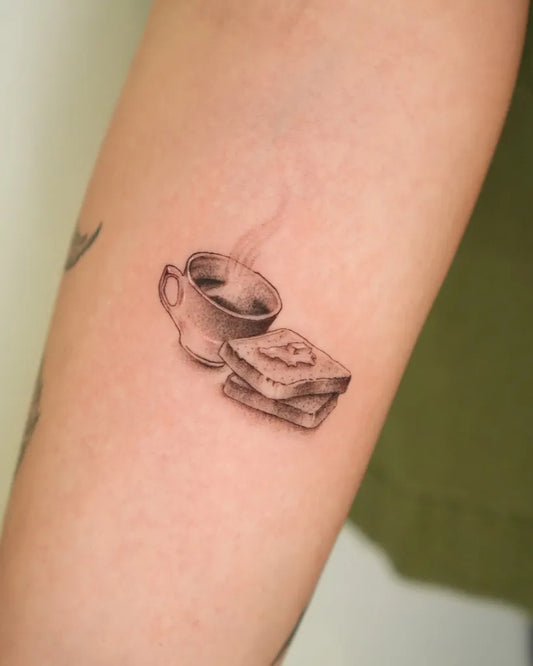 Small FineLine Coffee Cup and Toast on Women Arm Tattoo by @artcoholic_tattoo