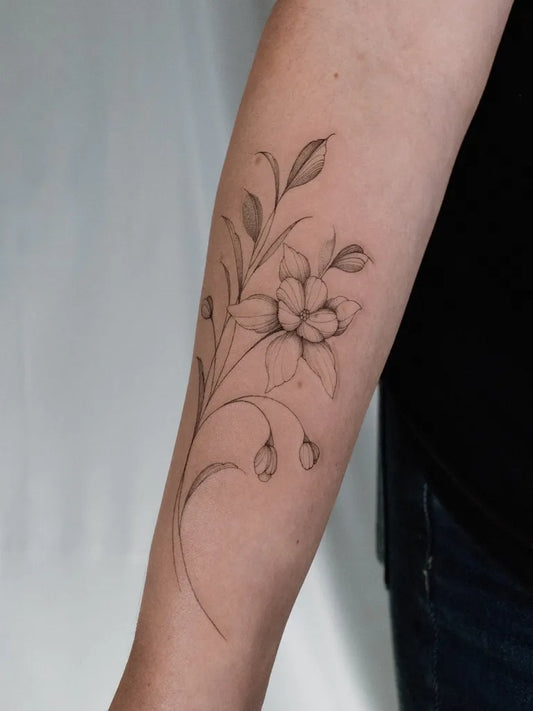 Small FineLine Delicate Daffodil Branch on Women Arm Flower Tattoo by @inkby.kristen