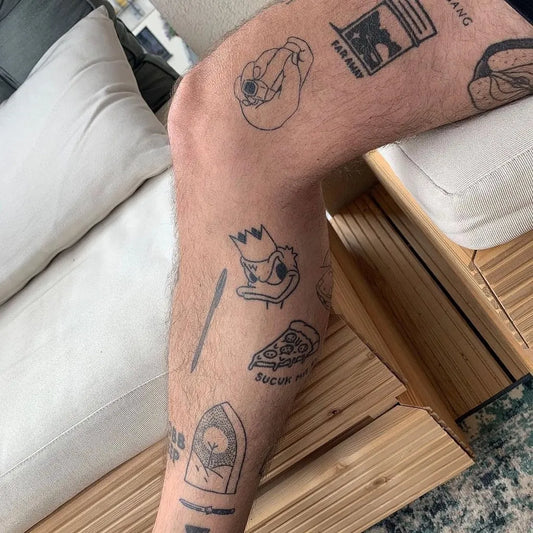 Small FineLine Duck Pizza Crown on Men Leg Tattoo by @ignorantstyletattoo