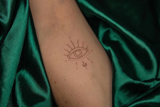 Small FineLine Evil Eye on Women Arm Tattoo by @richi.tats