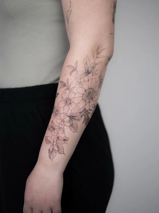 Small FineLine FloralArrangementDahlias on Women Arm Flower Tattoo by @joe.thefloraltattooist