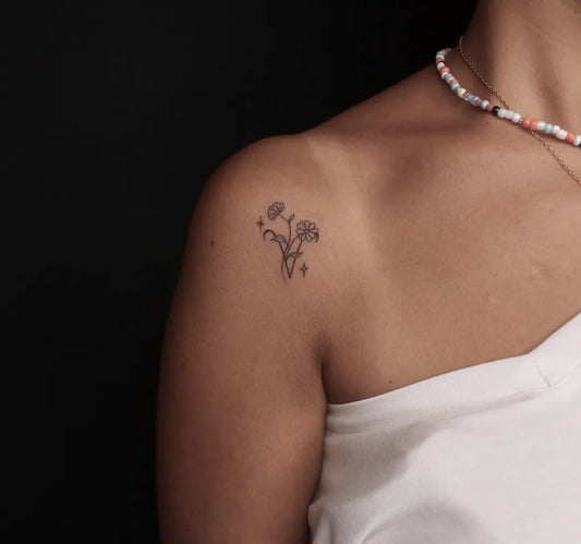 Small FineLine Flowers on Women Shoulder Tattoo by @cerentoyran.ink