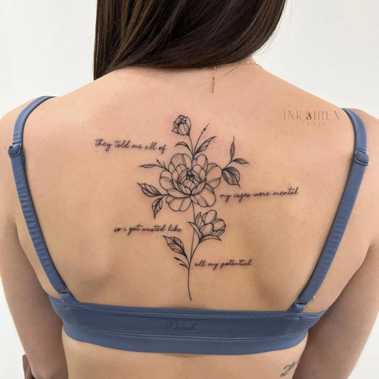 Small FineLine FlowersandQuote on Women Spine Tattoo by @inksirenstudio