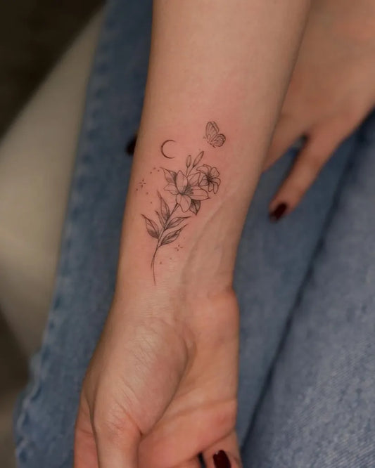 Small FineLine Hibiscus Flower Butterfly Moon on Women Wrist Flower Tattoo by @butterfly_._tattoo