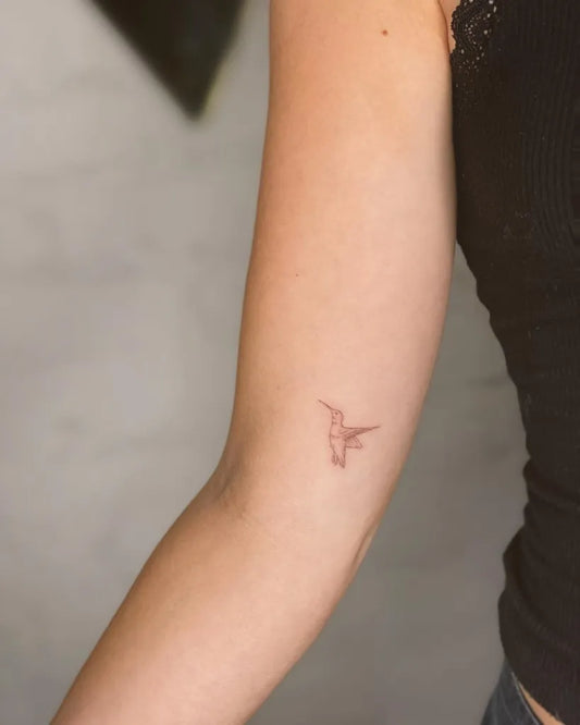 Small FineLine Hummingbird on Women Arm Tattoo by @tattoovasquez