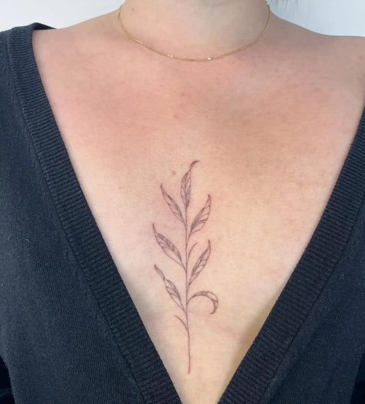 Small FineLine Leaf on Women Sternum Tattoo by @circle_tattoo_serena
