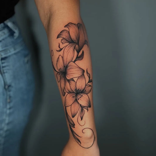 Small FineLine LilyFlowers on Women ArmFlower Tattoo by @21_dagastattoo