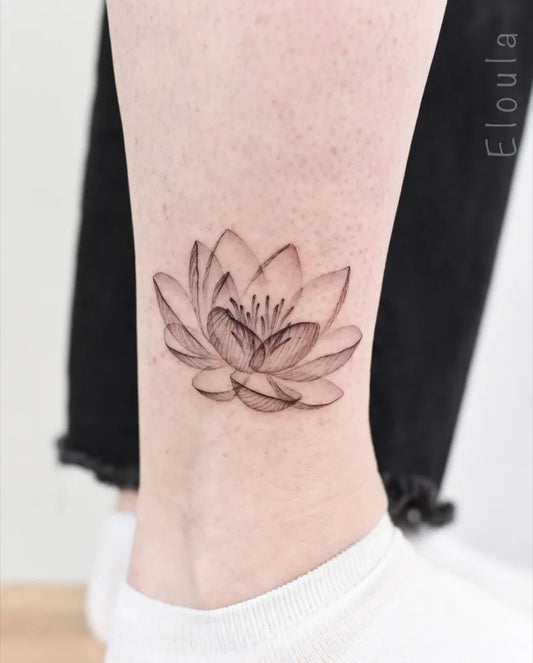 Small FineLine Lotus Flower on Women Ankle Tattoo by @eloula.tattoo