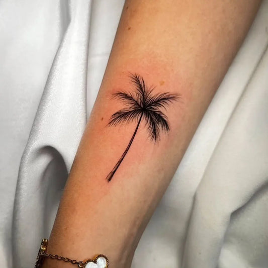 Small FineLine Palm Tree Tattoo on Women Arm by @janthiel_ink