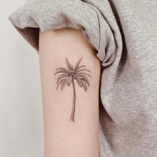 Small FineLine Palm Tree Tattoo on Women Arm by @tattooist_dante
