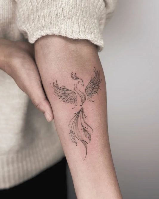 Small FineLine Phoenix on Women Arm Tattoo by @myracle_tattoo