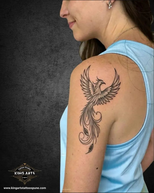 Small FineLine Phoenix on Women Shoulder Tattoo by @kingartstattoopune