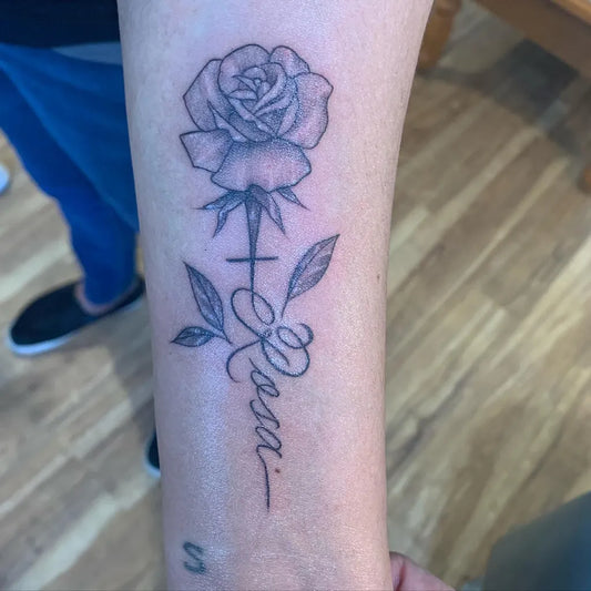 Small FineLine Rose with Cross and Name on Women Arm Tattoo by @norma_villa_tattoos