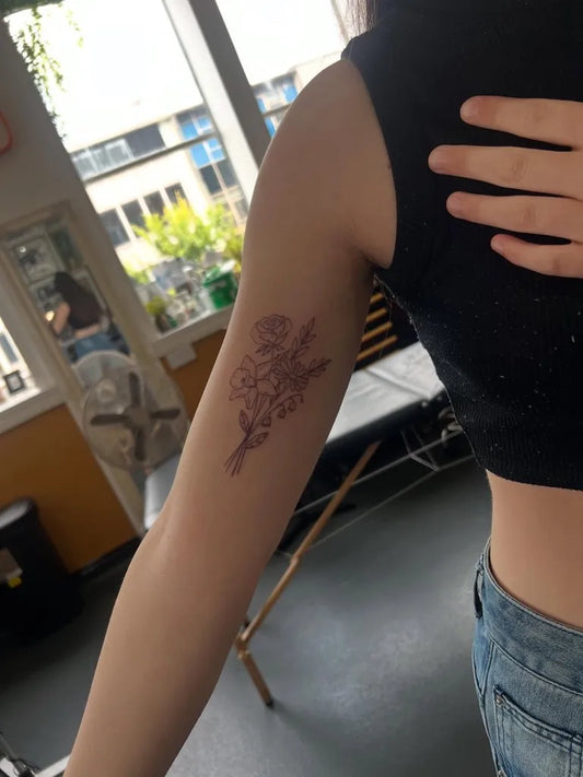 Small FineLine RoseFlower on Women Arm Flower Tattoo by @rachelangharadtattoos
