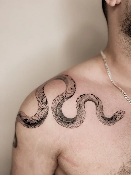 Small FineLine Snake on Men Shoulder Tattoo by @kimiatatts