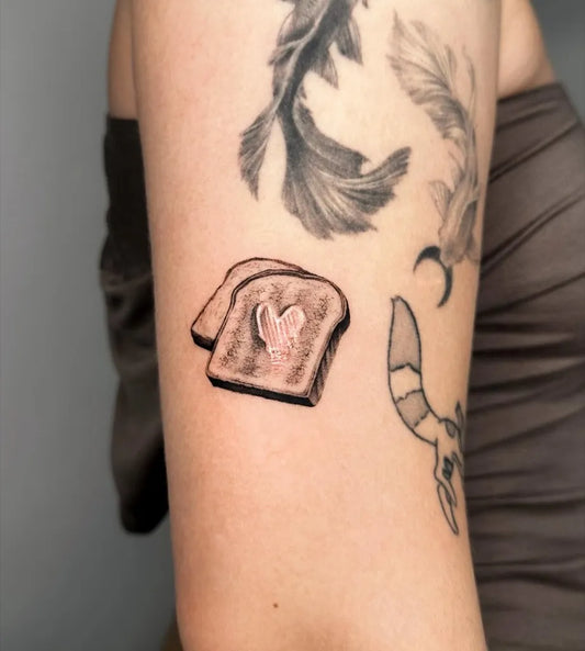 Small FineLine Toast Koi Fish on Women Arm Tattoo by @lily.shy