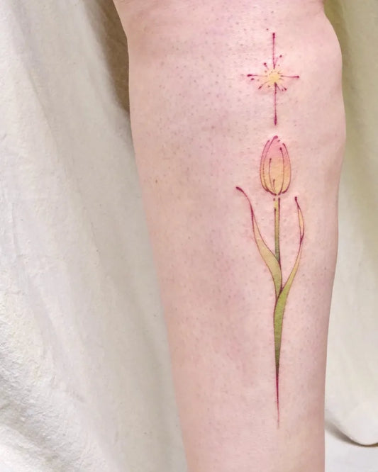 Small FineLine Tulip Star Tattoo on Women Leg by @uwendyxx.tat