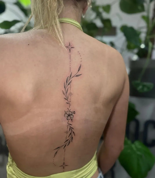 Small FineLine Vine Star Flower on Women Spine Tattoo by @luce.tattoos