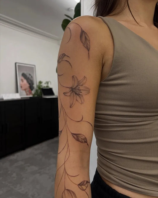 Small FineLine Vines and Lily on Women Arm Flower Tattoo by @vixentatts
