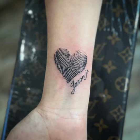 Small Fingerprint Heart Jason on Women Wrist Tattoo by @javitsunamitattoos