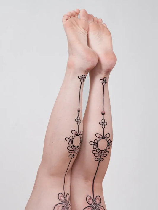 Small Floral Chains on Women Leg Tattoo by @tattooist_sion