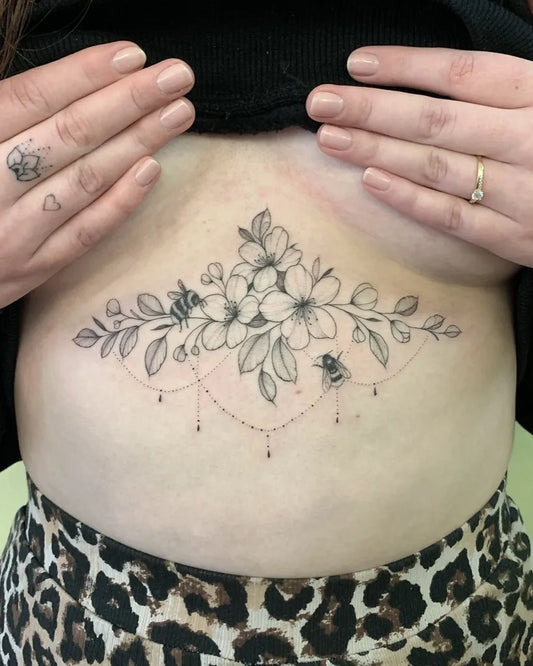 Small Floral Flowers Bee Branches on Women Sternum Tattoo by @ainoholopainen