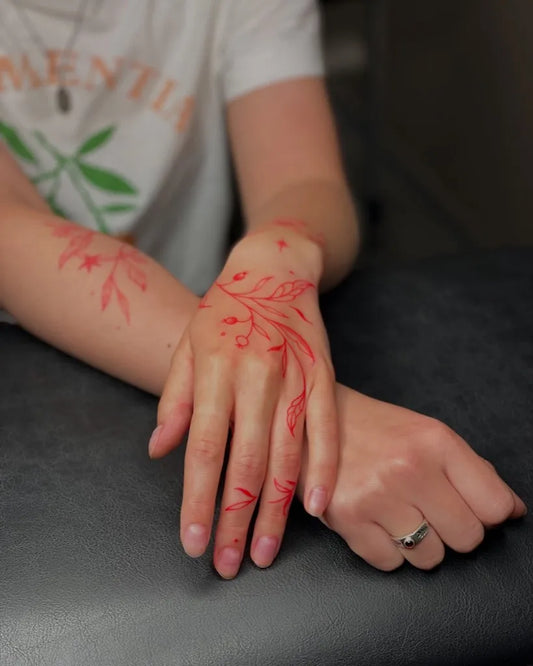 Small Floral Leaves and Flowers on Women Arms Tattoo by @redink_club