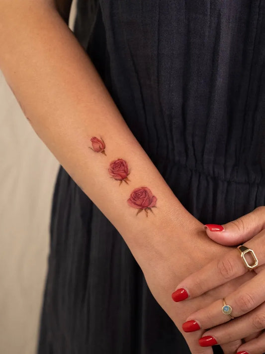 Small Floral Rose Buds on Women Arm Tattoo by @ozge.ink