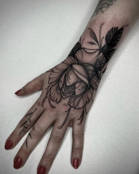 Small Floral Rose with Face and Leaves on Women Wrist Tattoo by @creaaxelle