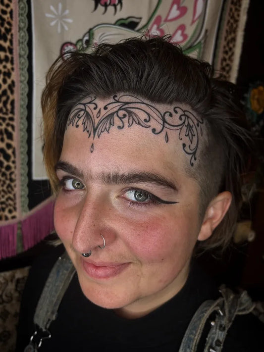 Small Floral Vine on Women Face Tattoo by @bb.hurricane