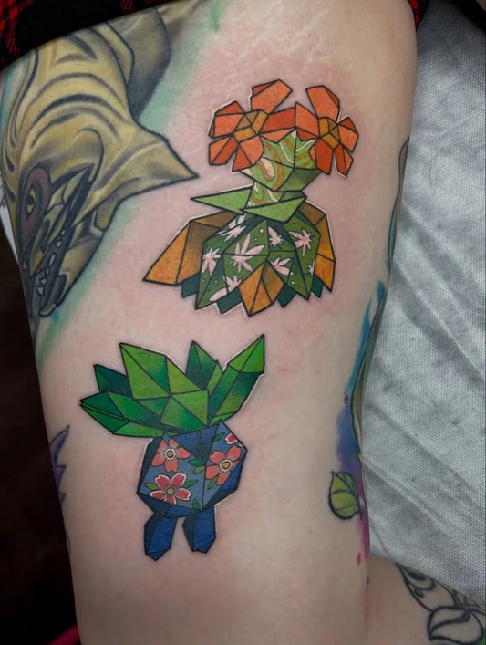 Small Geometric Bellossom Pokemon Tattoo on Women Leg by @little.bee.stings