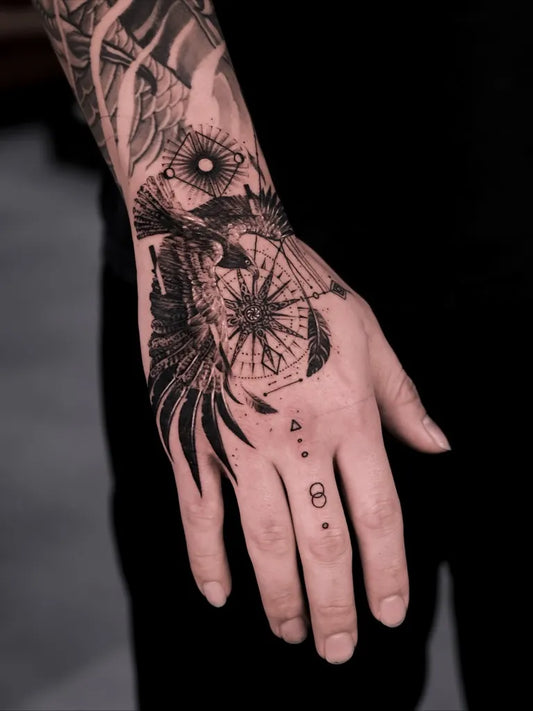 Small Geometric Eagle Compass on Men Hand Tattoo by @even_gmt.ink