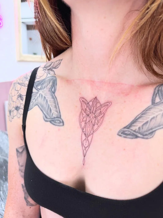 Small Geometric Flower on Women Chest Tattoo by @nicsnobullshitbookreviews