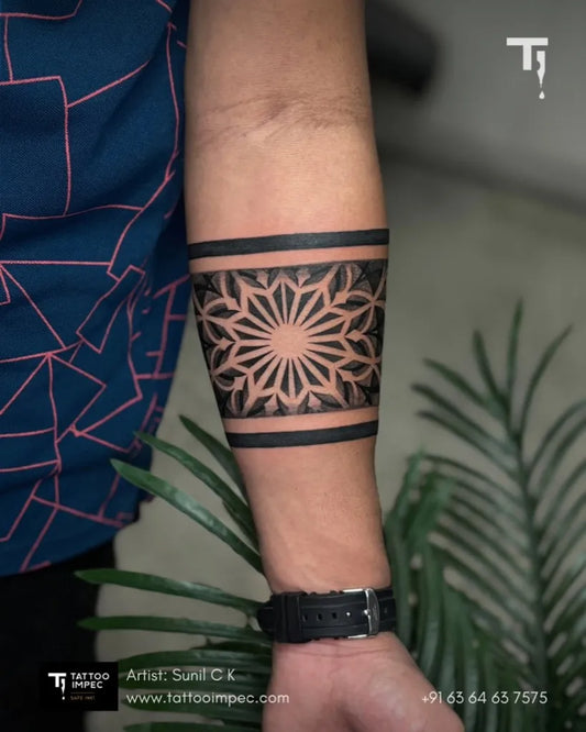 Small Geometric Mandala Band on Men Arm Tattoo by @tattoo_impec_mysuru
