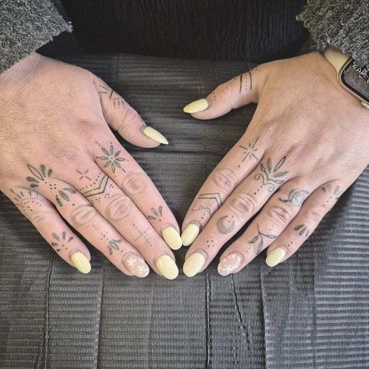 Small Geometric Mandala on Women Fingers Tattoo by @nikki.kelly.tattoos