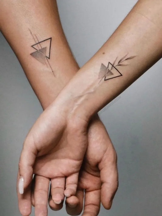 Small Geometric Triangles and Arrow on Couple Arms Matching Tattoo by @ink_balance_tattoos