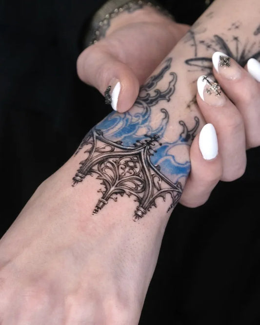 Small Gothic Gothic Arch Flames Tattoo on Women Wrist by @40.tatt