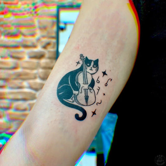 Small Illustrative Cat Playing Violin Tattoo on Women Arm by @felatdelibalta