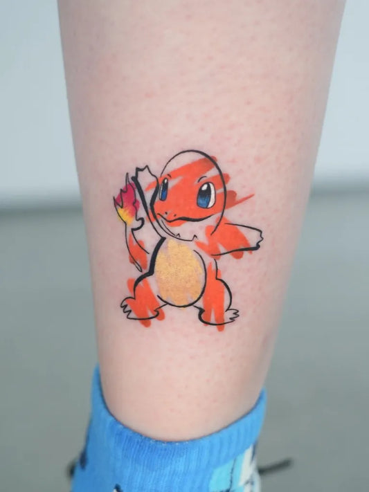 Small Illustrative Charmander Tattoo on Women Leg by @gil_miguel_tattoo_