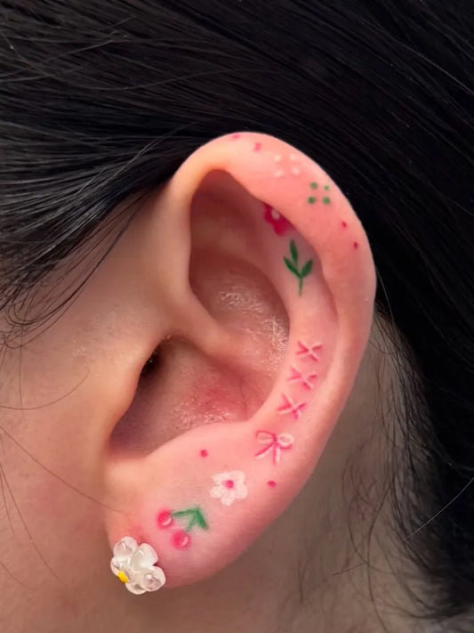 Small Illustrative Cherries and Flowers Tattoo on Women Behind the Ear by @pulmun_tattoo